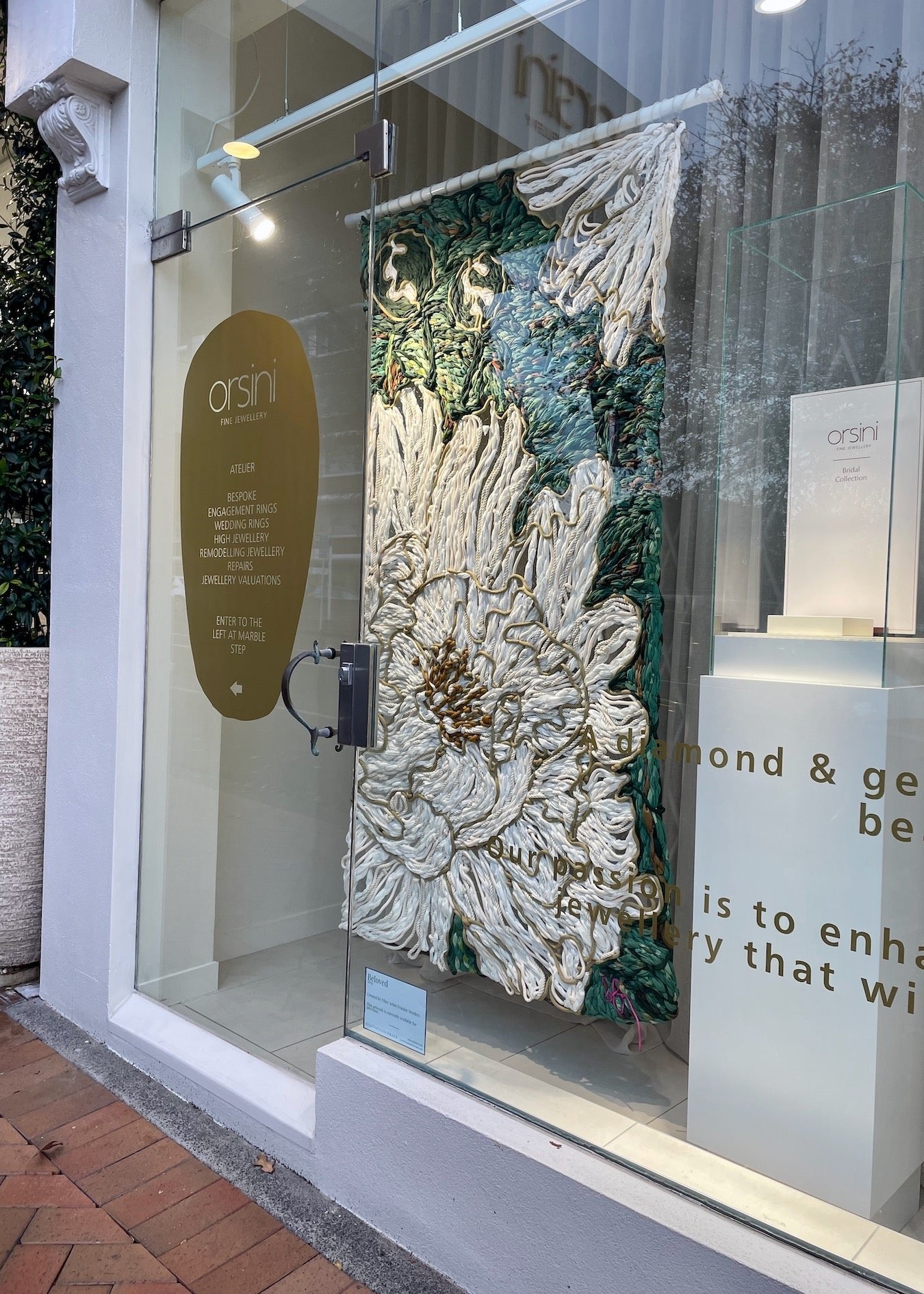 Beautiful luxury store window textile artwork made from recycled rope and discarded street banners
