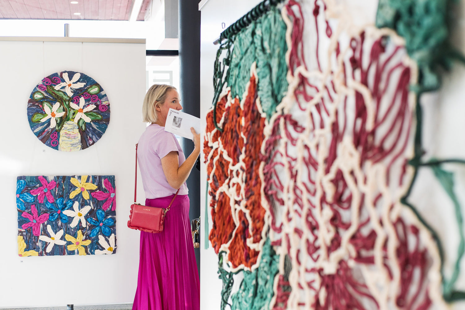 Giant embroidery made from colourful rope and discarded street banners - that would have gone to landfill - made into yarn and embroidered into colourful artwork