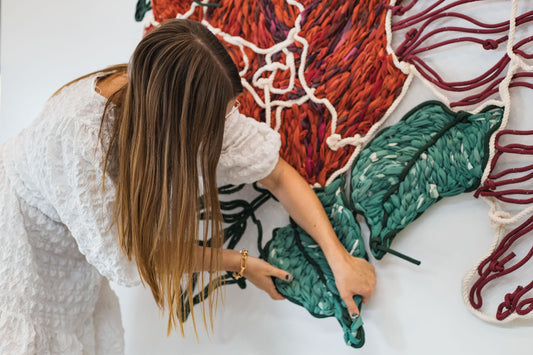 Giant embroidery made from colourful rope and discarded street banners - that would have gone to landfill - made into yarn and embroidered into colourful artwork Frankie Meaden