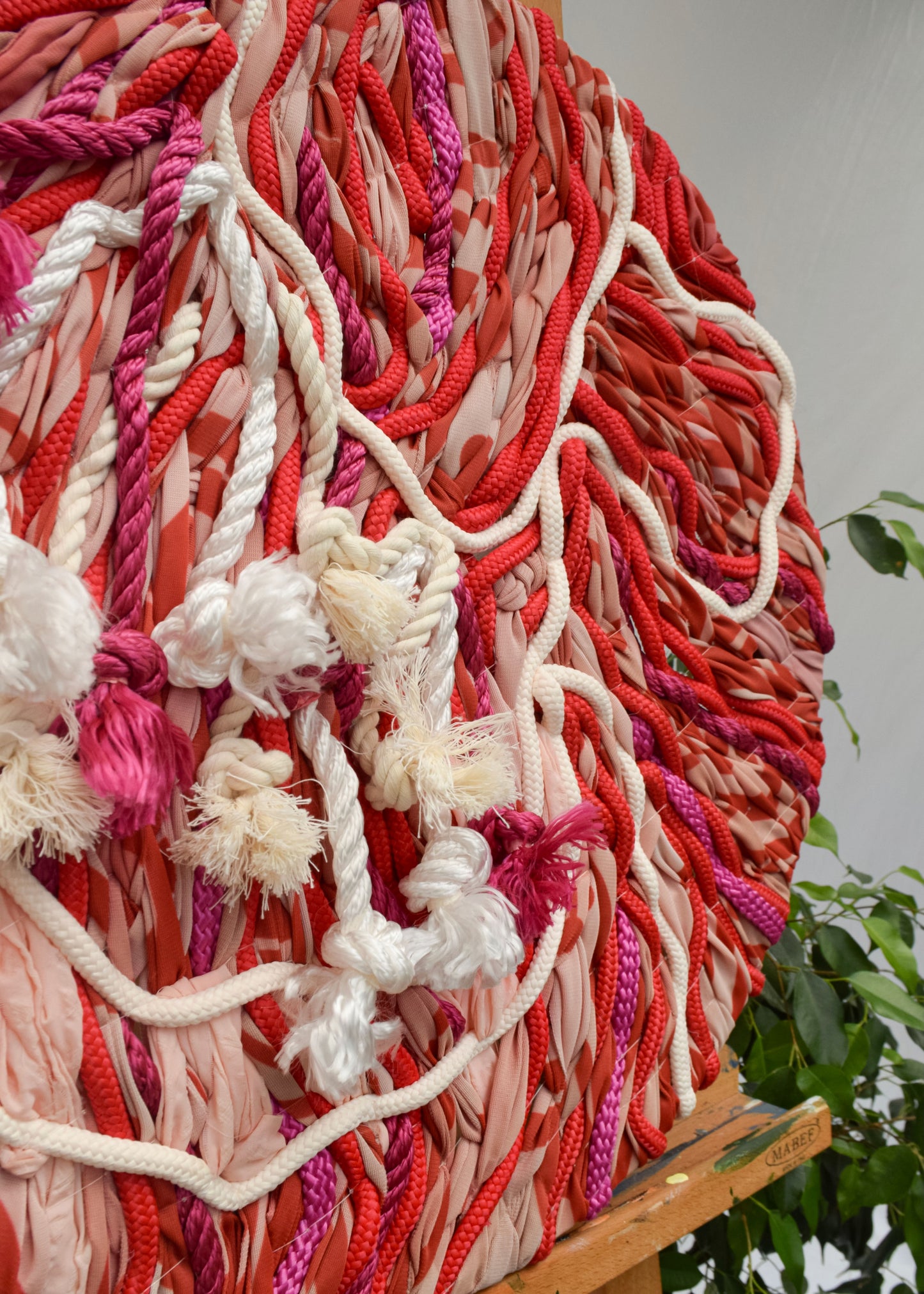 Close up detail of statement red floral embroidery with expressive, abstract shapes