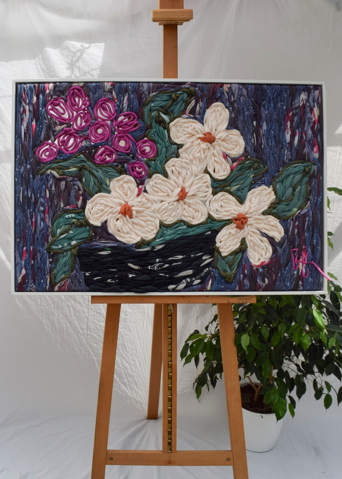 Hand embroidered floral still life showing flowers in a vase by Frankie Meaden