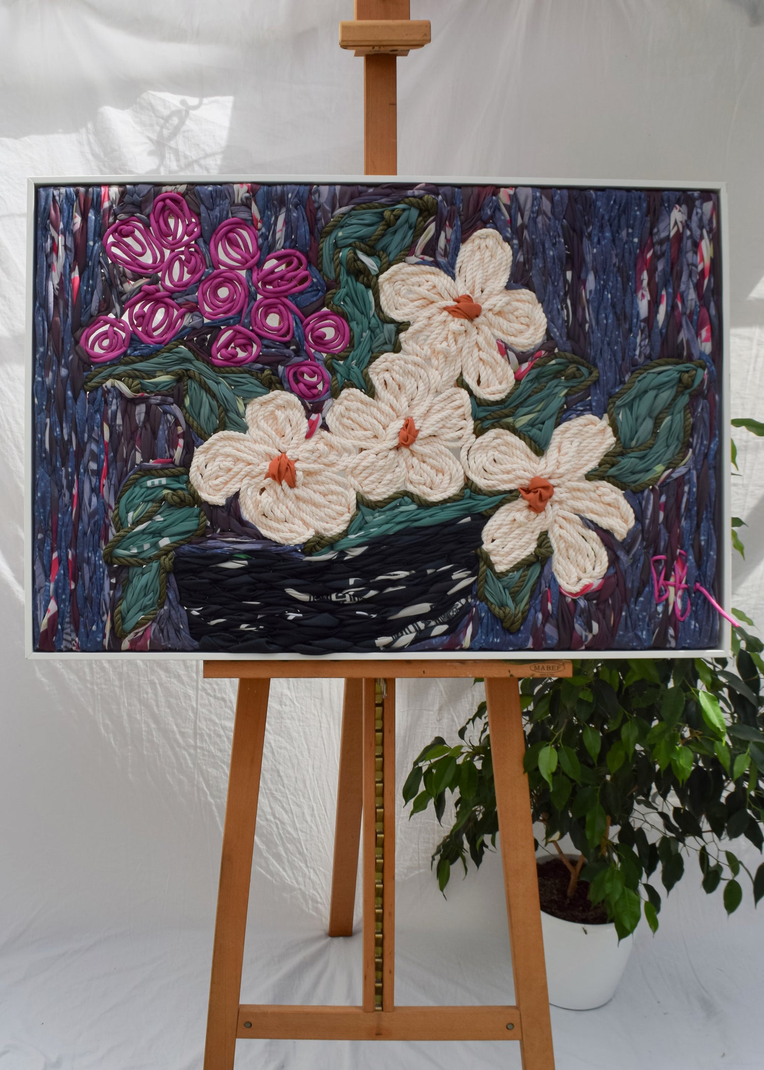 Hand embroidered floral still life showing flowers in a vase by Frankie Meaden
