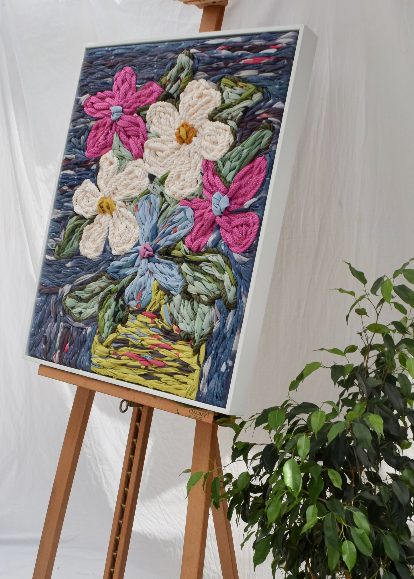 Statement floral embroidery tapestry with flowers styled in a vase