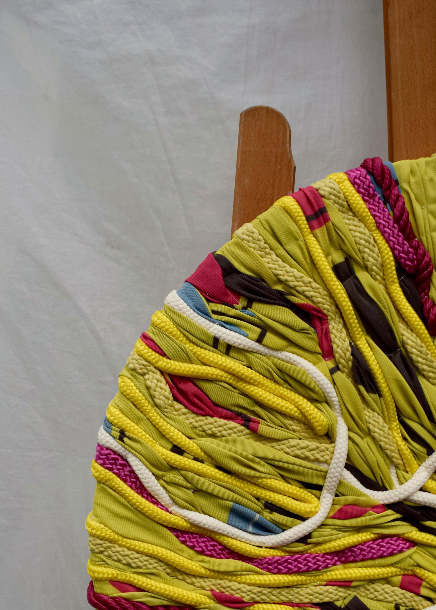 Close-up of textured yellow floral embroidery, abstract oversized artwork