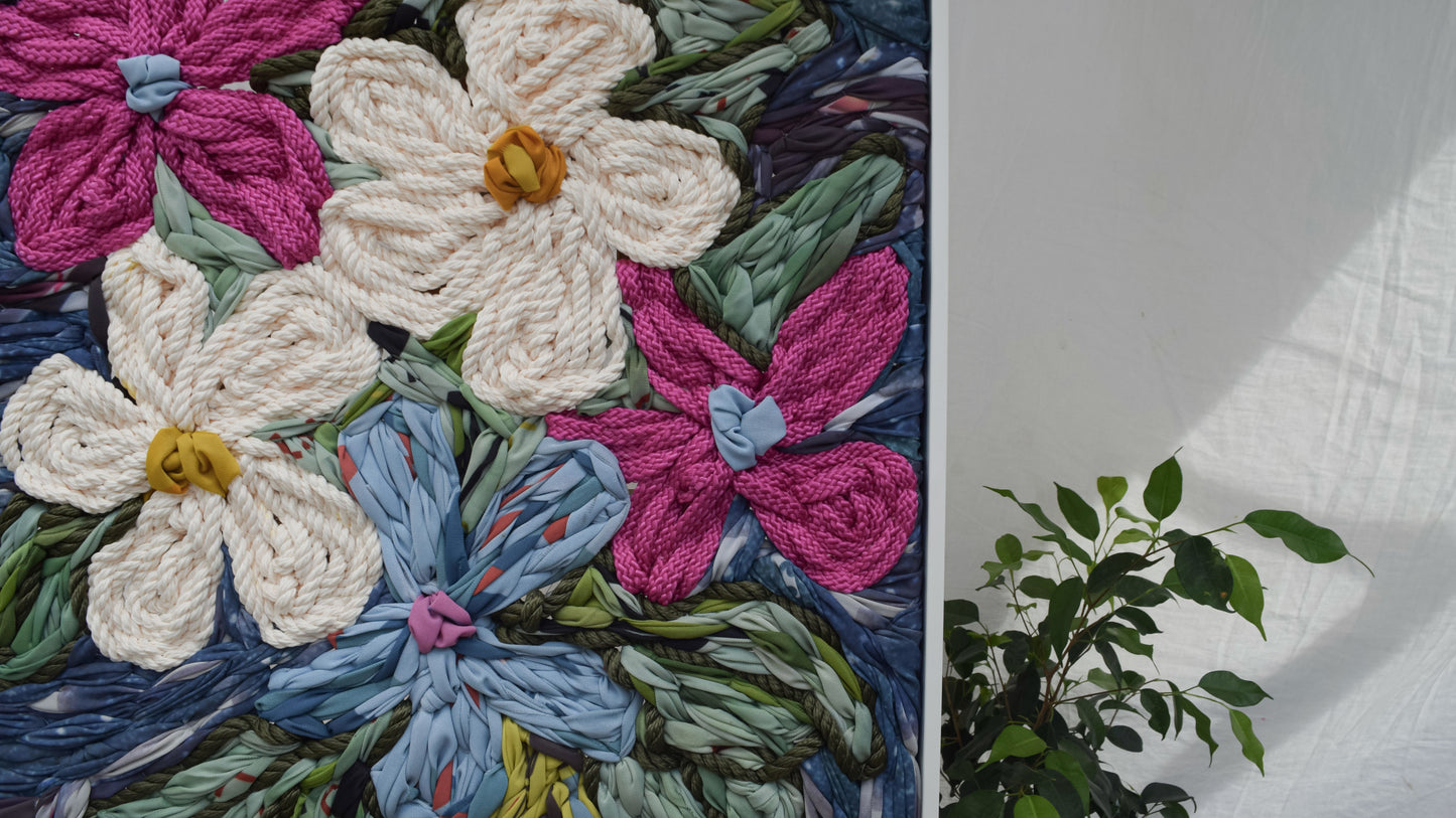 Giant floral embroidery wall hanging with flowers displayed in a vase